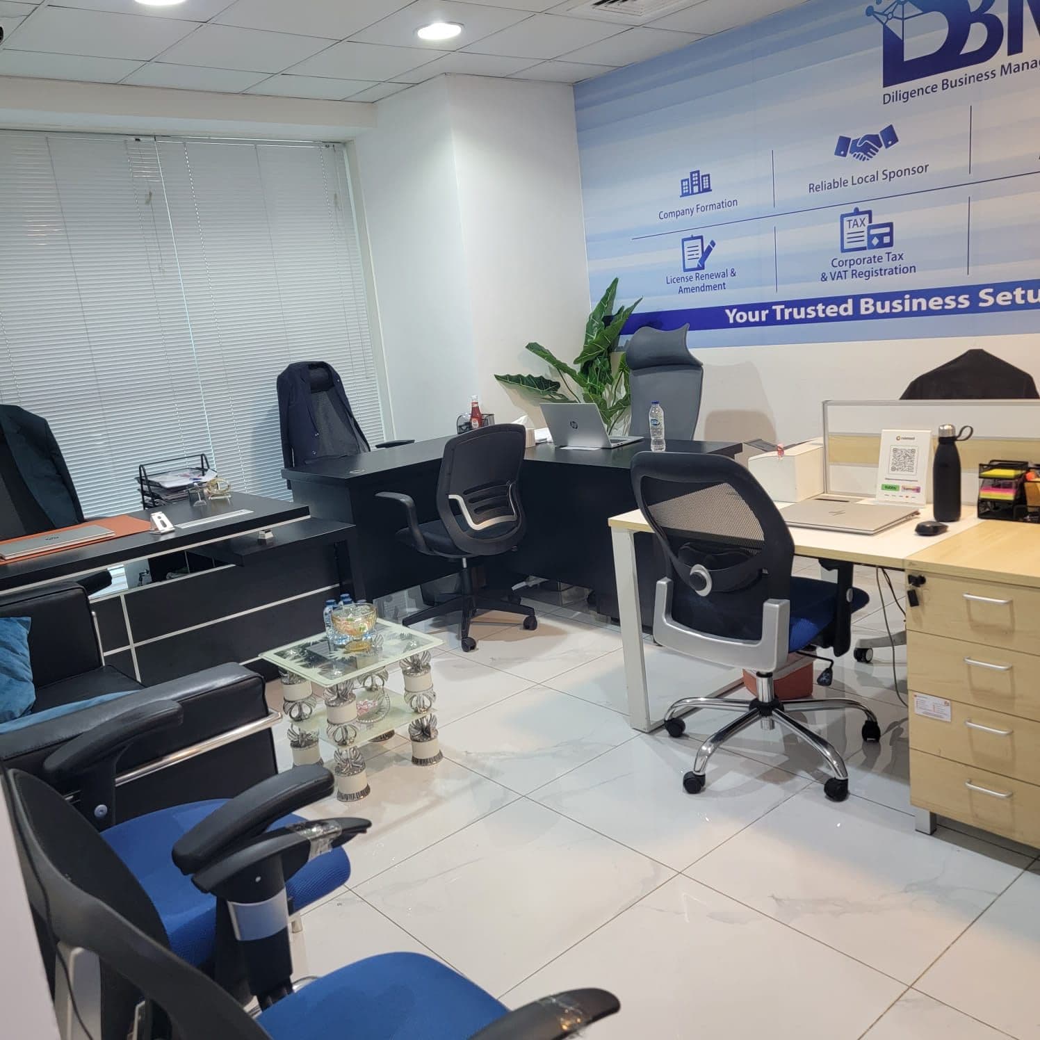 Consultation desks and client seating inside the DBM office on Sheikh Zayed Road, Dubai
